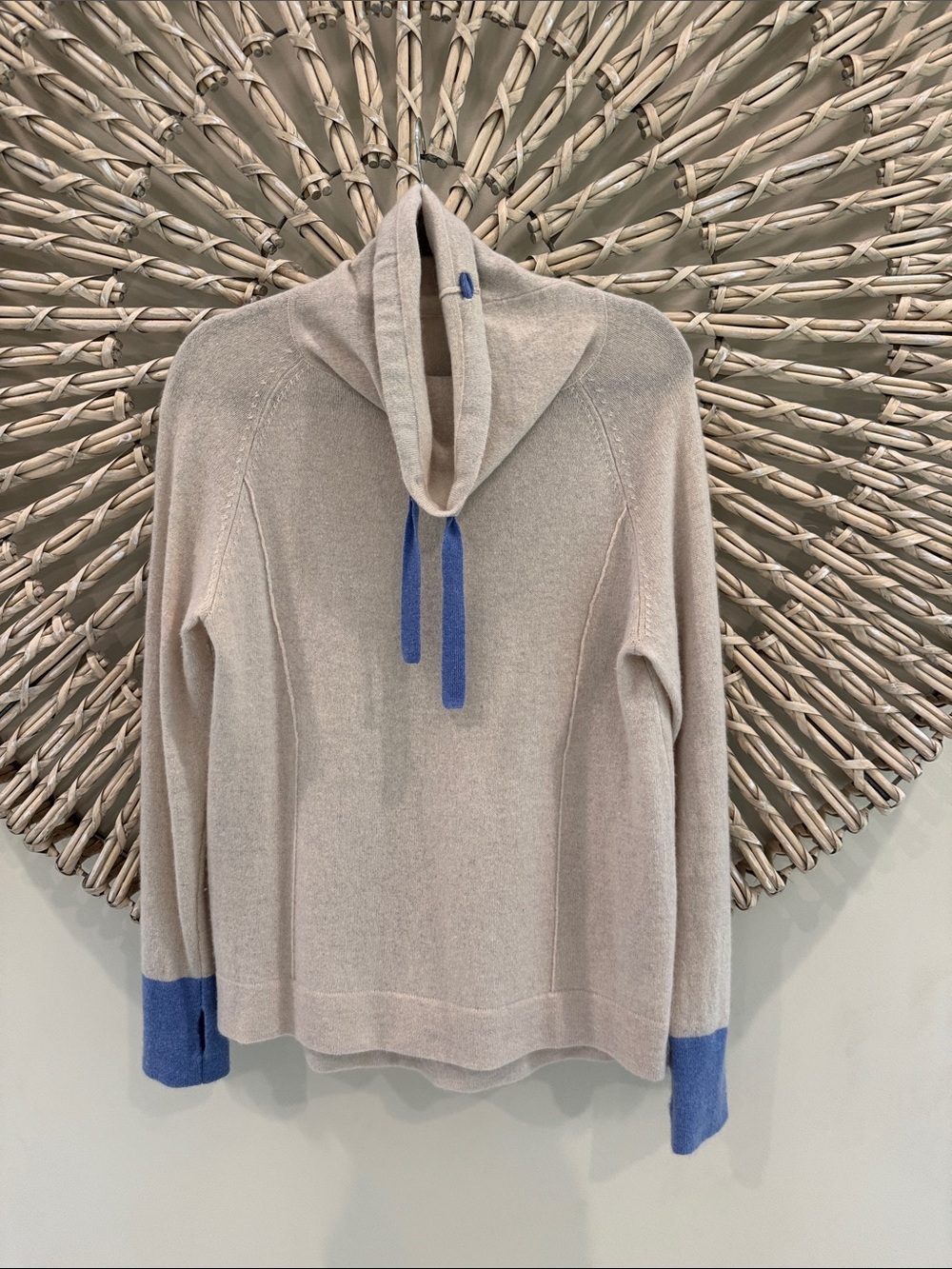 Cortland Park Cashmere cowl-neck sweater.